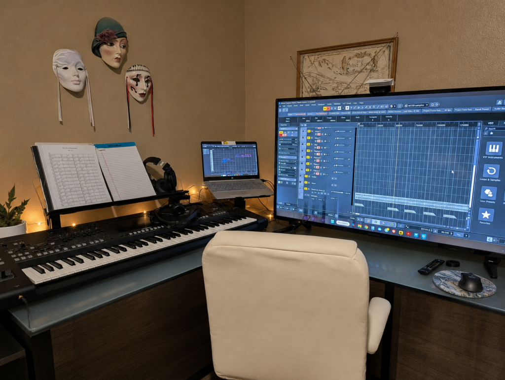 One of Nicole Victoria Lauren’s home studio workspace with keyboard, headphones, and music production tools
